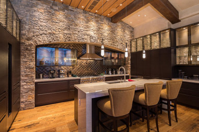 Inspiration for a rustic kitchen remodel in Chicago with flat-panel cabinets and an island
