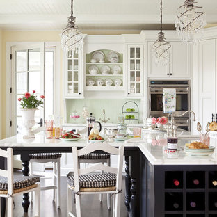 Mid-sized traditional open concept kitchen ideas - Open concept kitchen - mid-sized traditional l-shaped dark wood floor open concept kitchen idea in Minneapolis with recessed-panel cabinets, white cabinets, an undermount sink, marble countertops, green backsplash, stainless steel appliances and an island