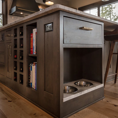 Large mountain style l-shaped light wood floor and beige floor open concept kitchen photo in Denver with an undermount sink, shaker cabinets, dark wood cabinets, quartz countertops, beige backsplash, subway tile backsplash, stainless steel appliances, an island and white countertops