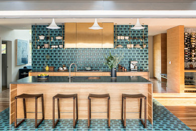 Inspiration for a mid-sized contemporary ceramic tile kitchen remodel in Denver with an undermount sink, quartz countertops, ceramic backsplash, stainless steel appliances, an island, open cabinets and multicolored backsplash