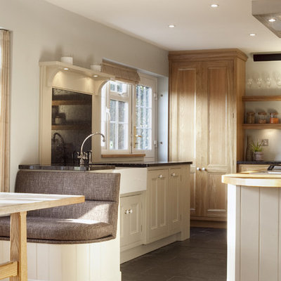 Kitchen - traditional kitchen idea in London with stainless steel appliances, a farmhouse sink and granite countertops