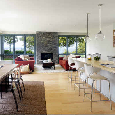 Example of a trendy galley open concept kitchen design in Burlington with a farmhouse sink, flat-panel cabinets and blue cabinets