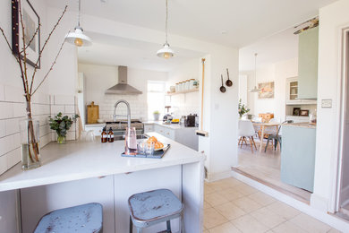 This is an example of a medium sized victorian open plan kitchen in Sussex.