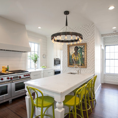 Example of a transitional l-shaped kitchen design in Boston with shaker cabinets, white cabinets and stainless steel appliances