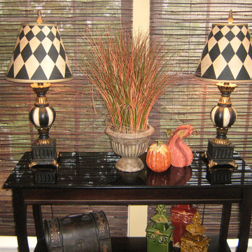 Table in kitchen dining area decorated for fall.