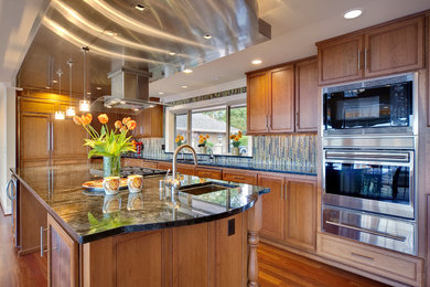 Example of a tuscan kitchen design in Seattle