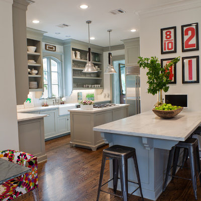 Kitchen - transitional kitchen idea in Houston with a farmhouse sink, stainless steel appliances, open cabinets and gray cabinets