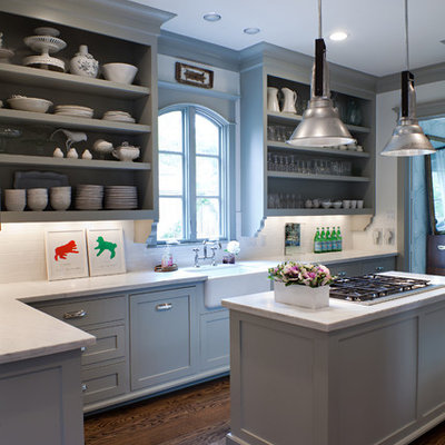 Example of a transitional kitchen design in Houston with a farmhouse sink, open cabinets, blue cabinets, white backsplash and subway tile backsplash