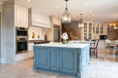 Eat-in kitchen - huge country u-shaped beige floor eat-in kitchen idea in Indianapolis with a farmhouse sink, raised-panel cabinets, white cabinets, marble countertops, white backsplash, ceramic backsplash, stainless steel appliances and two islands