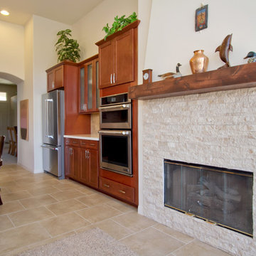 Contemporary Fireplace with Stacked Stone and Wood Mantle in Temecula Kitchen Re