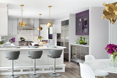 Example of a mid-sized trendy vinyl floor and gray floor kitchen design in New York with flat-panel cabinets, purple cabinets, quartz countertops, metallic backsplash, mirror backsplash, stainless steel appliances, an island and white countertops