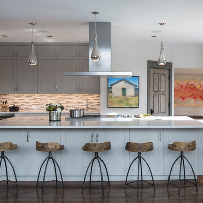 Example of a mid-sized mountain style u-shaped dark wood floor open concept kitchen design in Other with shaker cabinets, gray cabinets, gray backsplash, matchstick tile backsplash and an island