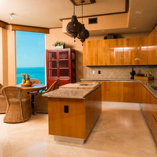 Expansive asian u-shaped kitchen in Miami with an undermount sink, flat-panel cabinets, medium wood cabinets, granite benchtops, stone slab splashback, stainless steel appliances, marble floors and with island.