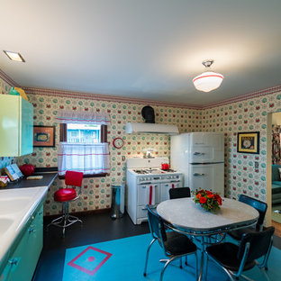 Mid-sized midcentury l-shaped separate kitchen in Seattle with a double-bowl sink, louvered cabinets, green cabinets, yellow splashback, linoleum floors and no island.