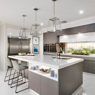 This is an example of a large contemporary galley open plan kitchen in Perth with an undermount sink, flat-panel cabinets, dark wood cabinets, quartz benchtops, stainless steel appliances, porcelain floors, with island, white floor and window splashback.