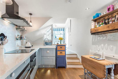 This is an example of a beach style kitchen in Cornwall.