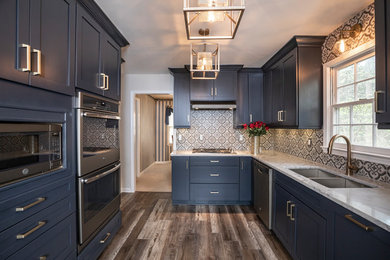 Enclosed kitchen - small modern galley vinyl floor and multicolored floor enclosed kitchen idea in Atlanta with an undermount sink, shaker cabinets, blue cabinets, quartz countertops, multicolored backsplash, porcelain backsplash, colored appliances, no island and gray countertops