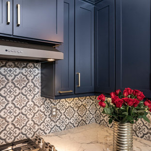 Small modern galley separate kitchen in Atlanta with an undermount sink, shaker cabinets, blue cabinets, quartz benchtops, multi-coloured splashback, porcelain splashback, coloured appliances, vinyl floors, no island, multi-coloured floor and grey benchtop.