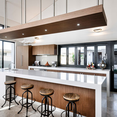 Large trendy galley kitchen photo in Perth with flat-panel cabinets, dark wood cabinets, paneled appliances, an island, a double-bowl sink, quartzite countertops, gray backsplash and glass sheet backsplash