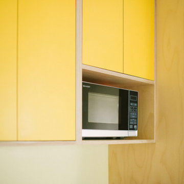 The Bradys - Orange and Yellow Plywood Kitchen