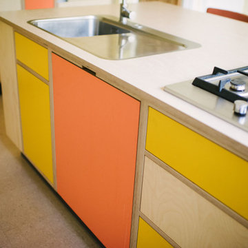 The Bradys - Orange and Yellow Plywood Kitchen