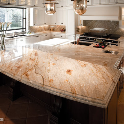 Tuscan kitchen photo in Houston with white cabinets and quartzite countertops