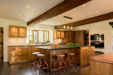 Large country l-shaped kitchen in Other with a double-bowl sink, an island, flat-panel cabinets, brown cabinets and grey floors.