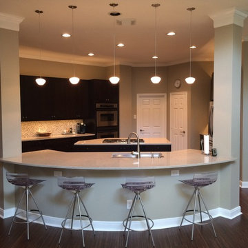 The Family Room Faces this Open Kitchen, With Seating for Four or More