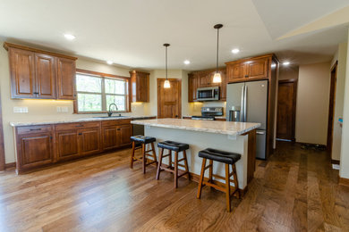 Example of a country kitchen design in Milwaukee