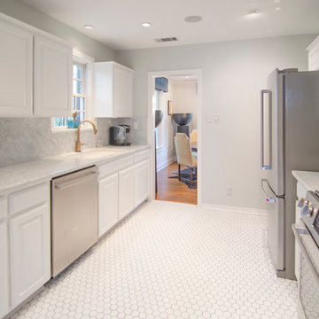 The final product of Project Westover -- white cabinets, Carrara countertops and