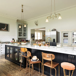 Large eclectic enclosed kitchen ideas - Large eclectic single-wall medium tone wood floor and brown floor enclosed kitchen photo in Other with shaker cabinets, gray cabinets, marble countertops, white backsplash, subway tile backsplash, white appliances and a peninsula