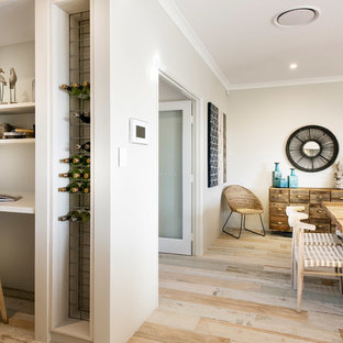 Photo of a large beach style u-shaped kitchen pantry in Perth with an undermount sink, flat-panel cabinets, light wood cabinets, quartz benchtops, multi-coloured splashback, ceramic splashback, stainless steel appliances, ceramic floors and no island.
