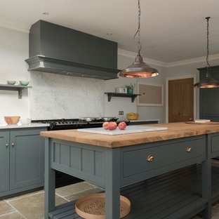 Contemporary eat-in kitchen remodeling - Eat-in kitchen - contemporary limestone floor eat-in kitchen idea in Other with shaker cabinets, gray cabinets and an island