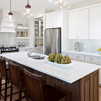 Elegant kitchen photo in Calgary with stainless steel appliances