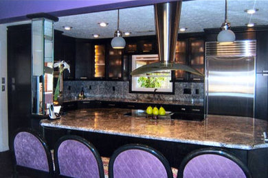Photo of a medium sized contemporary galley open plan kitchen in Other with a double-bowl sink, glass-front cabinets, black cabinets, granite worktops, multi-coloured splashback, stainless steel appliances, ceramic flooring and an island.
