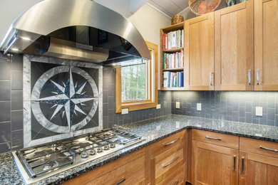 Mid-sized eclectic u-shaped gray floor open concept kitchen photo in Other with an undermount sink, shaker cabinets, light wood cabinets, granite countertops, gray backsplash, subway tile backsplash, stainless steel appliances, an island and multicolored countertops