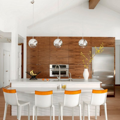 Inspiration for a scandinavian galley light wood floor kitchen remodel in St Louis with an undermount sink, flat-panel cabinets, medium tone wood cabinets, stainless steel appliances, an island and quartz countertops