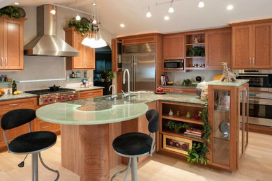 Large minimalist l-shaped light wood floor eat-in kitchen photo in San Francisco with a drop-in sink, shaker cabinets, medium tone wood cabinets, stainless steel appliances and an island