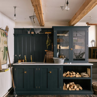 Mid-sized farmhouse kitchen designs - Kitchen - mid-sized farmhouse dark wood floor and brown floor kitchen idea in Other with an undermount sink, glass-front cabinets, blue cabinets and blue backsplash