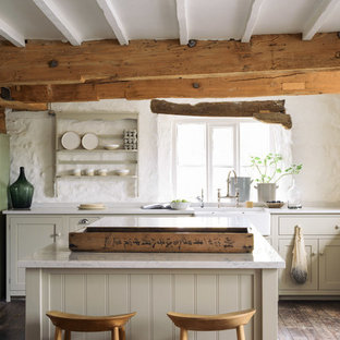 Farmhouse kitchen designs - Inspiration for a farmhouse l-shaped dark wood floor kitchen remodel in Other with a farmhouse sink, shaker cabinets, beige cabinets and an island