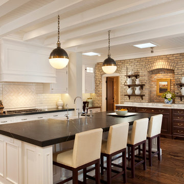 The Riverton Legacy Residence - kitchen with 1800s school house adobe brick wall