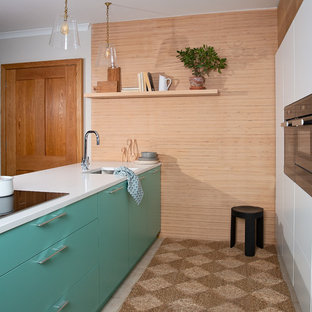 Inspiration for a small scandi galley kitchen in Other with flat-panel cabinets, quartz worktops, ceramic flooring, beige floors, white worktops, a submerged sink, black appliances, turquoise cabinets and a breakfast bar.