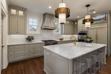 Example of a mid-sized u-shaped medium tone wood floor and brown floor eat-in kitchen design with an undermount sink, recessed-panel cabinets, gray cabinets, marble countertops, white backsplash, marble backsplash, stainless steel appliances, an island and white countertops