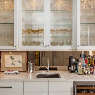 The wet bar with interior lighting is the perfect spot for displaying fine glass