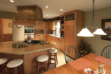 Eat-in kitchen - large contemporary l-shaped ceramic tile eat-in kitchen idea in New York with a drop-in sink, shaker cabinets, medium tone wood cabinets, laminate countertops, beige backsplash, stone tile backsplash, stainless steel appliances and an island