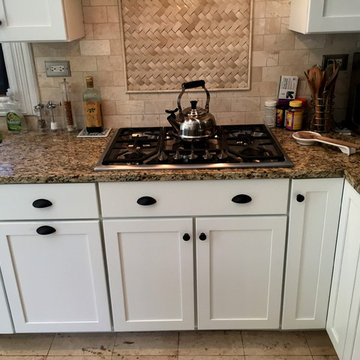 These dark cabinets were converted to  custom white cabinets in 5 days.  Crown m