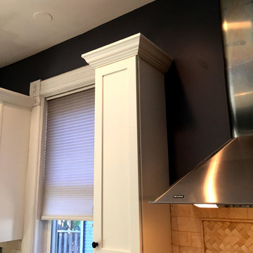 These dark cabinets were converted to  custom white cabinets in 5 days.  Crown m