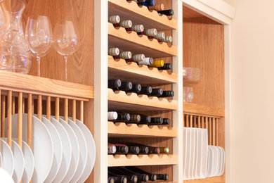 This is an example of a medium sized classic galley kitchen/diner in Cheshire with shaker cabinets, white cabinets, wood worktops and an island.