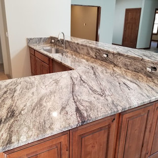 Kitchen inspiration - Kitchen photo in Seattle with an undermount sink, granite countertops and stone slab backsplash