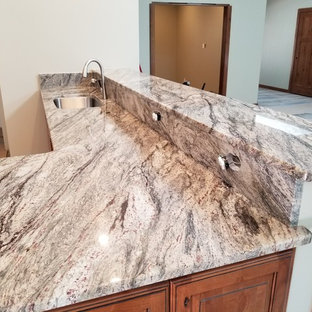 Kitchen remodeling - Kitchen - kitchen idea in Seattle with an undermount sink, granite countertops and stone slab backsplash